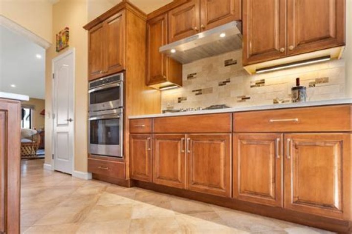 Can you Restain veneer cabinets