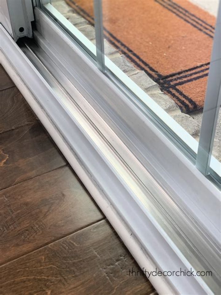 How do you clean sliding doors or window tracks