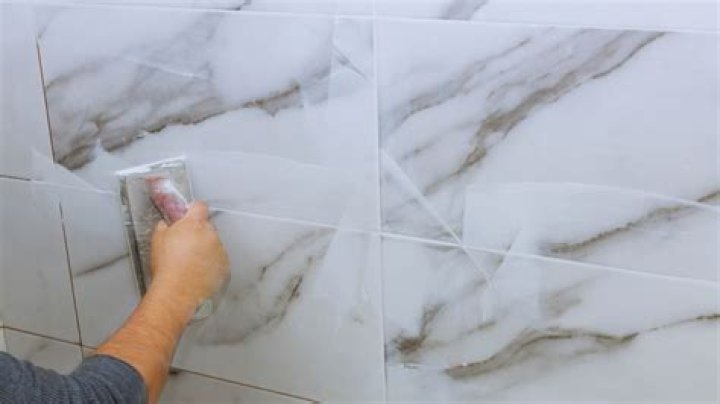 How do you grout marble