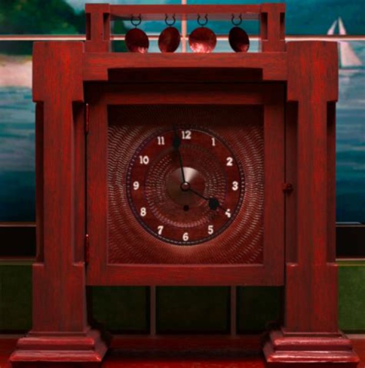 What does Gatsby knock off the mantelpiece