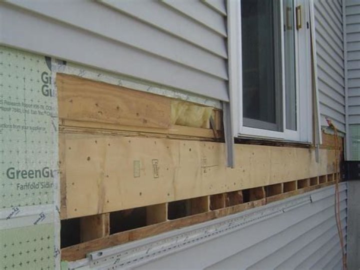What is behind vinyl siding