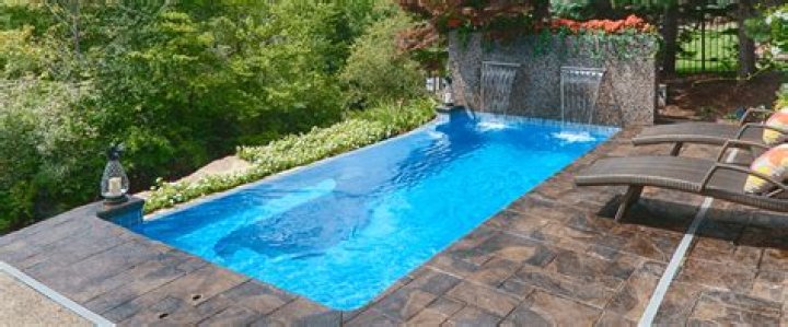 What is cheaper fiberglass or concrete pool