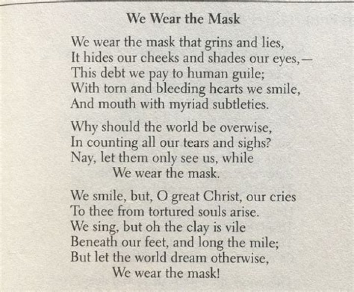What is the tone of the poem We Wear the Mask
