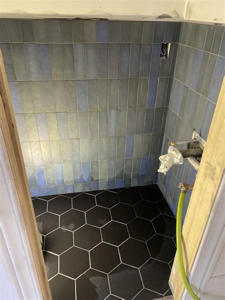 Why does black grout turned GREY
